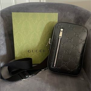 Like New Unisex Gucci embossed leather crossbody
